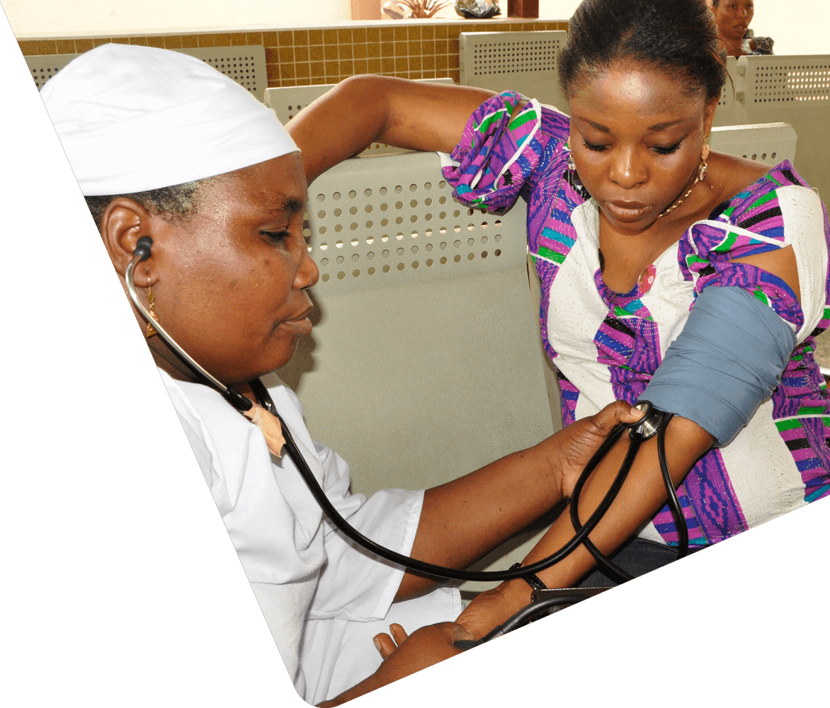 Doctor taking blood pressure with patient
