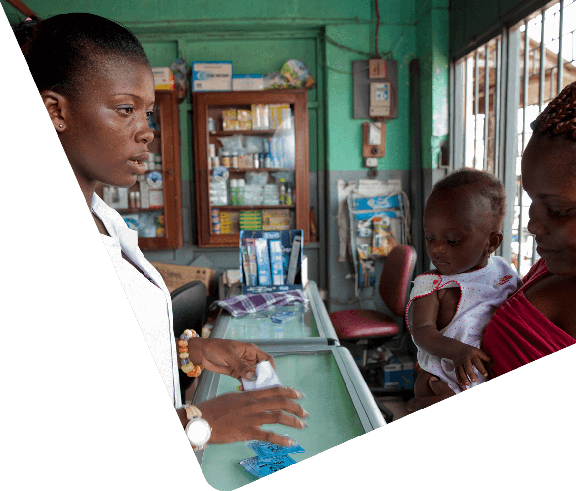 Mother and child talking to pharmacist