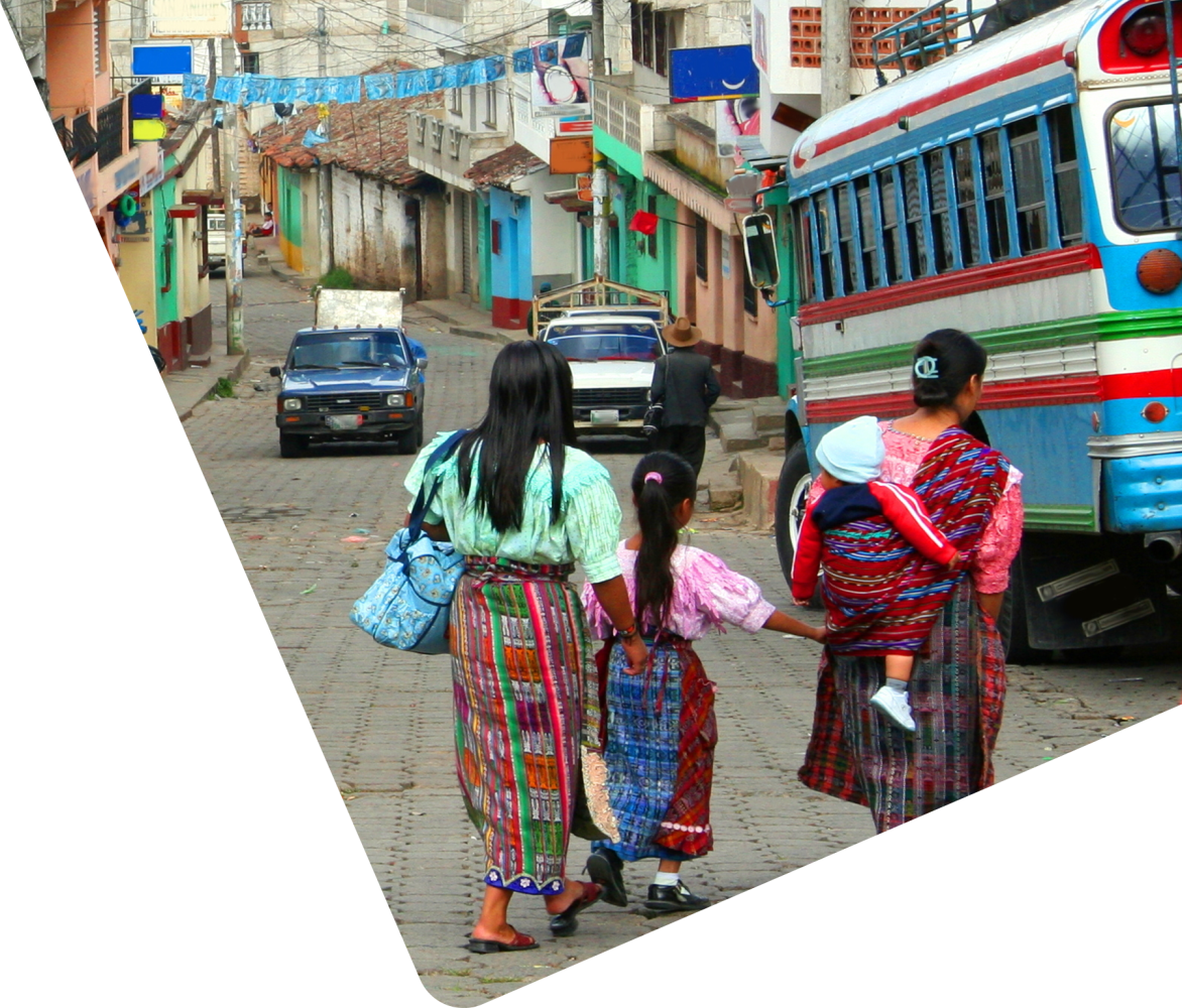 women next to bus in Guatemala